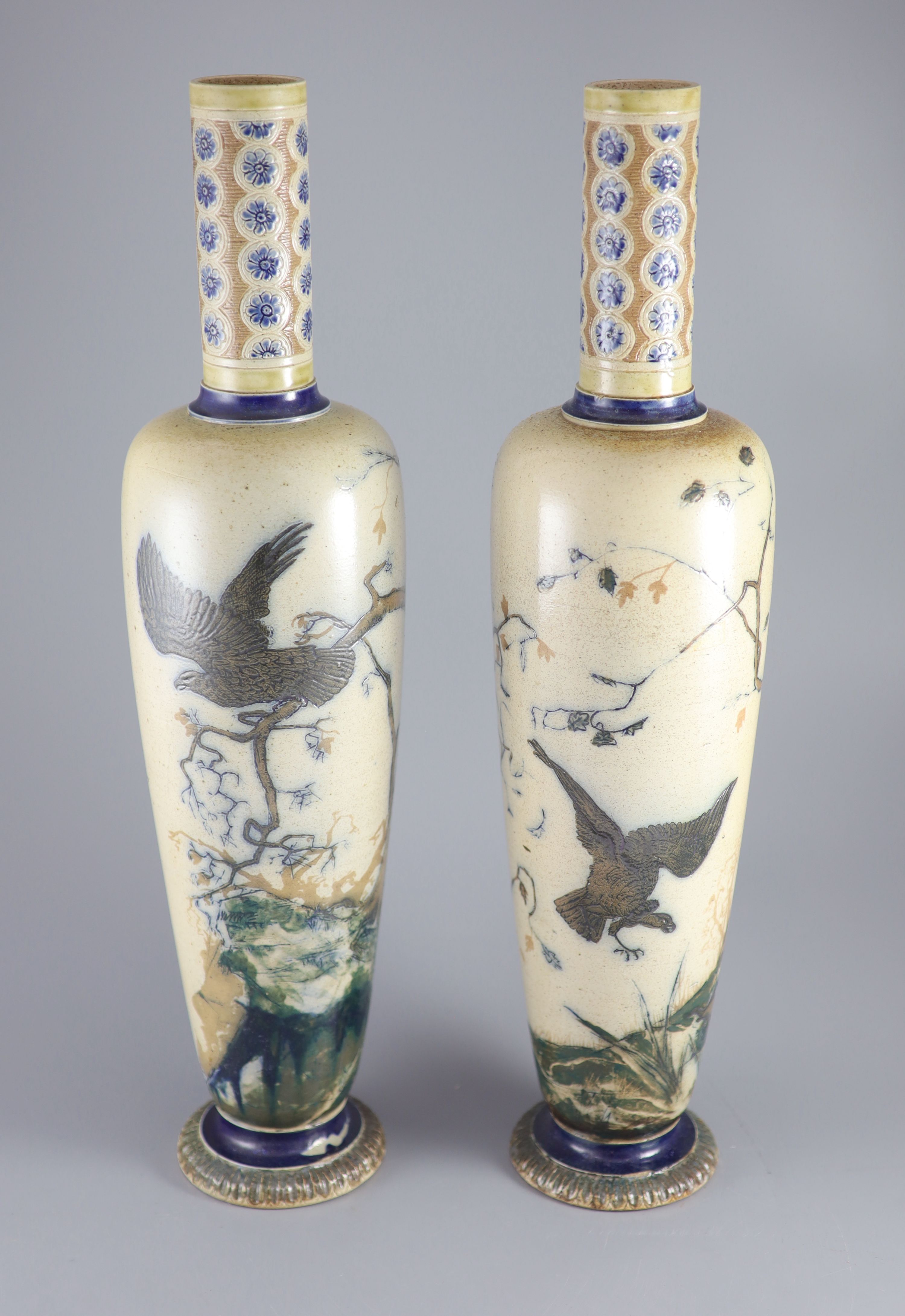 A pair of large Martin Brothers 'eagle and vulture' stoneware vases, dated 1878,
